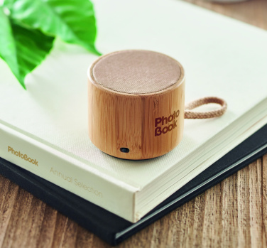 Logotrade promotional gift picture of: Round bamboo wireless speaker